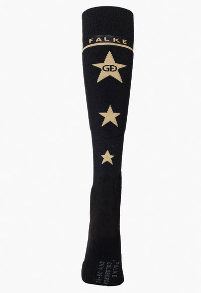 Goldbergh Altitude Black ski socks with gold stars and 'Falke' branding on a white background